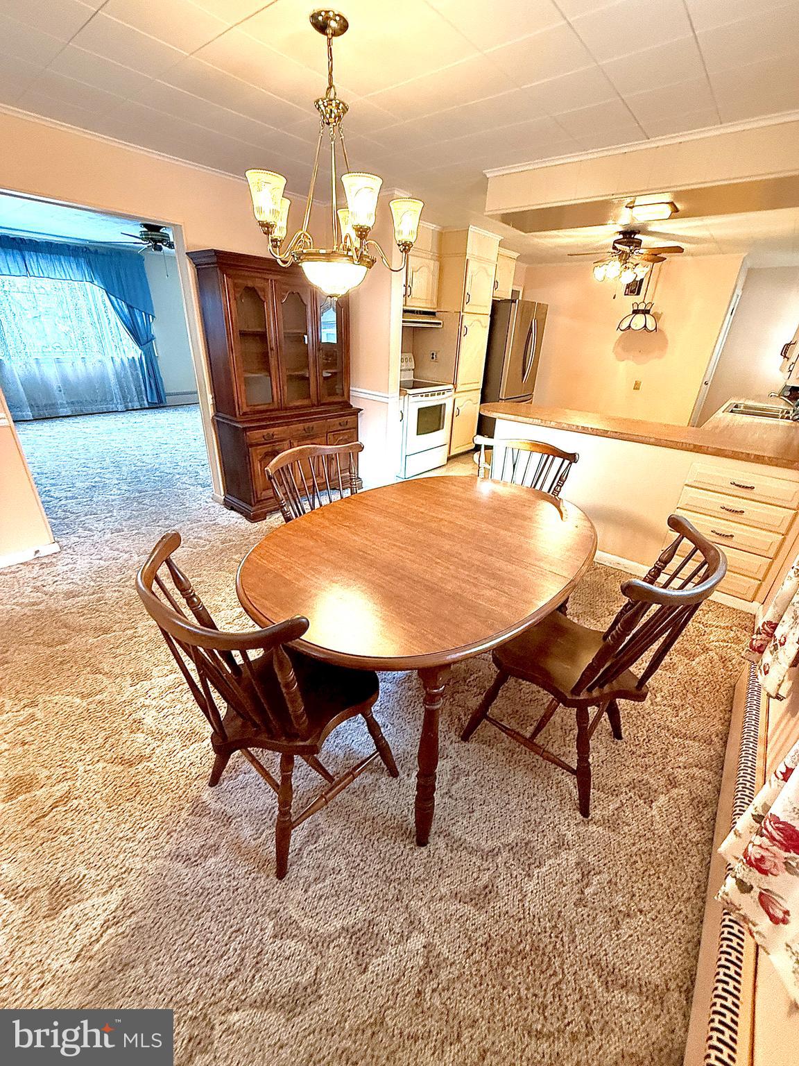 320 South Bonsall Road Coatesville, PA 19320 - Photo 14 of 36 a view of a dining room with furniture and wooden floor