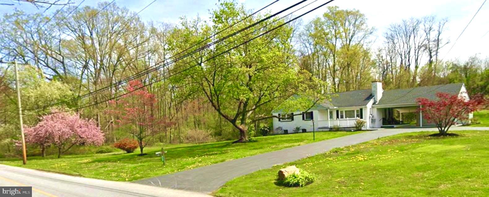 320 South Bonsall Road Coatesville, PA 19320 - Photo 2 of 36 a front view of house with yard and green space