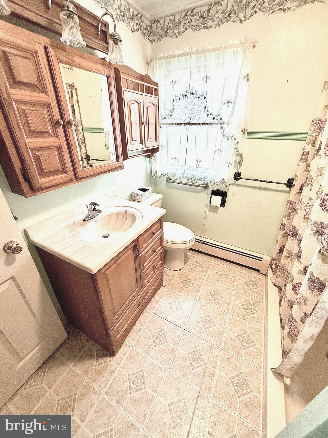 320 South Bonsall Road Coatesville, PA 19320 - Photo 21 of 36 a bathroom with a tub sink and mirror