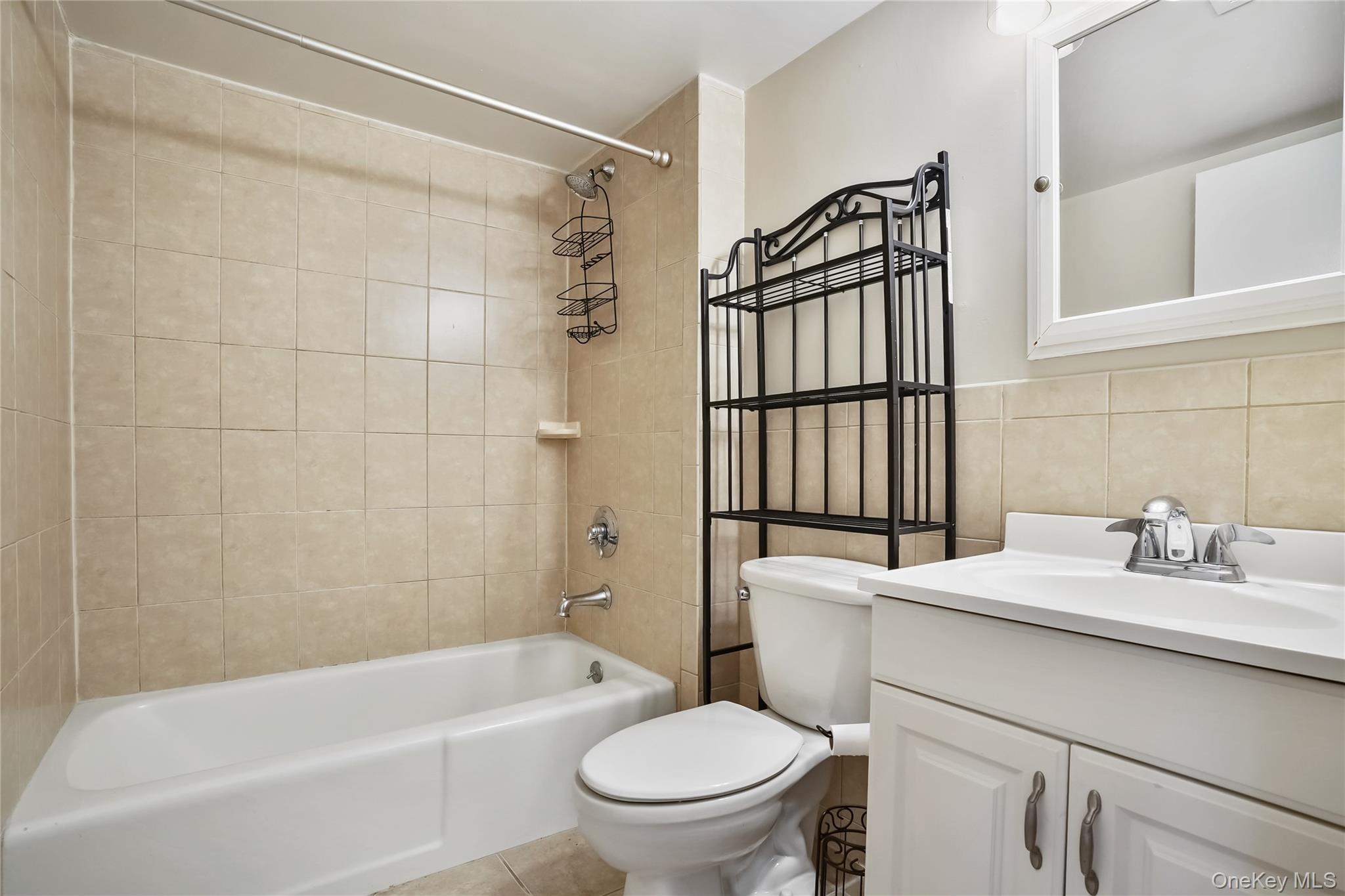 208 Harris Road, Unit HA3 Bedford, NY 10507 - Photo 17 of 41 Full bath featuring vanity, shower / bath combination, and tile walls