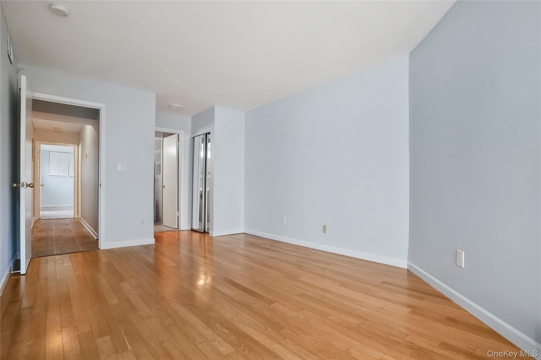208 Harris Road, Unit HA3 Bedford, NY 10507 - Photo 21 of 41 Spare room featuring light wood-style floors and baseboards