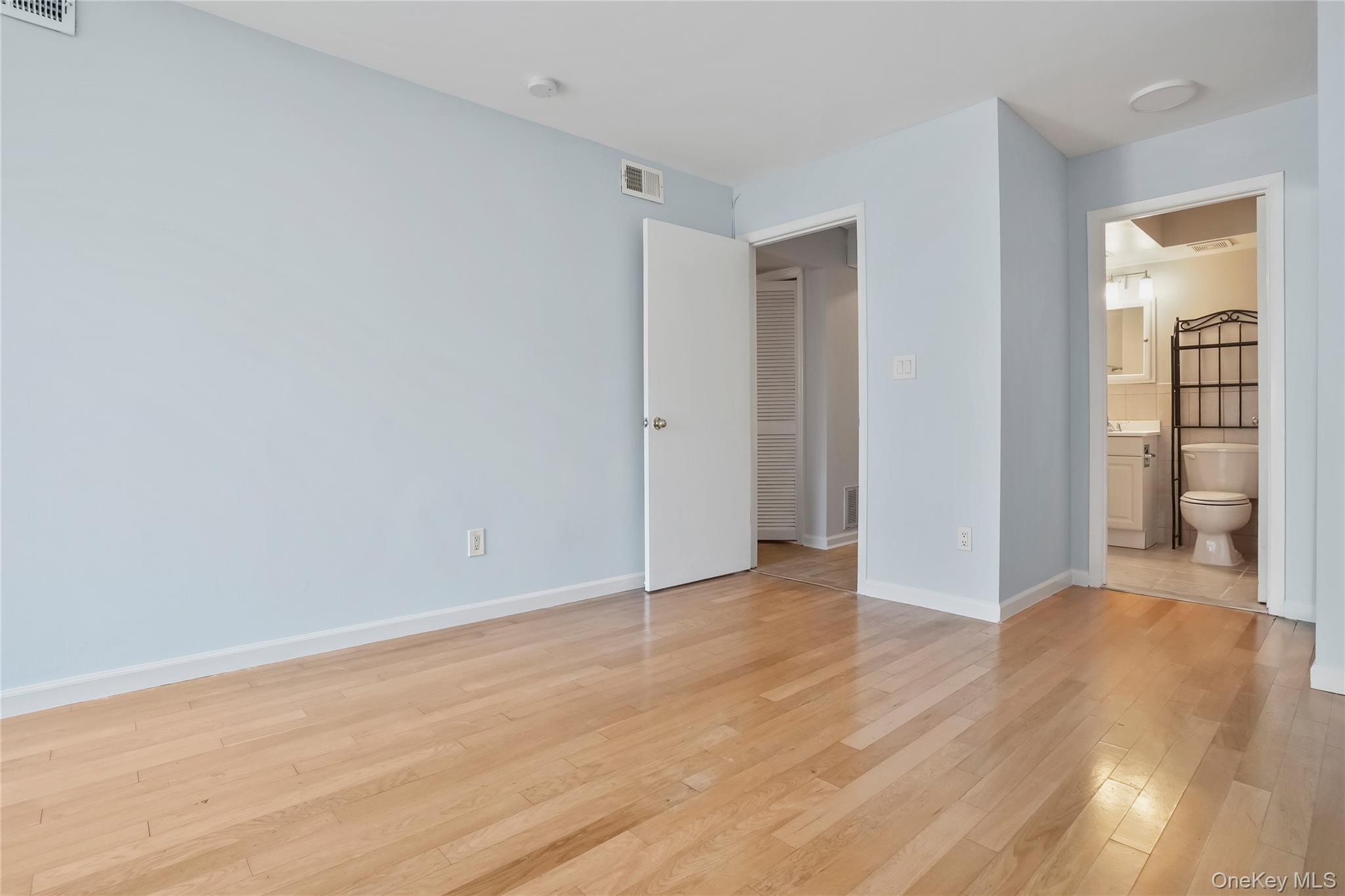 208 Harris Road, Unit HA3 Bedford, NY 10507 - Photo 22 of 41 Unfurnished bedroom featuring light wood-style floors and ensuite bath