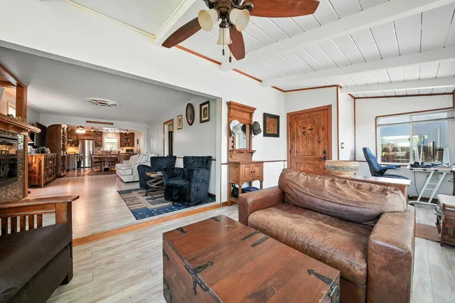 a living room with furniture flat screen tv and a fireplace