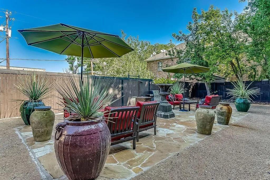 2805 Reagan Street, Unit 109 Dallas, TX 75219 - Photo 1 of 4 a view of a backyard with sitting area and furniture