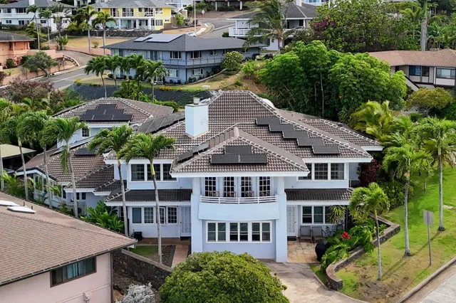 a aerial view of a house with yard and plants