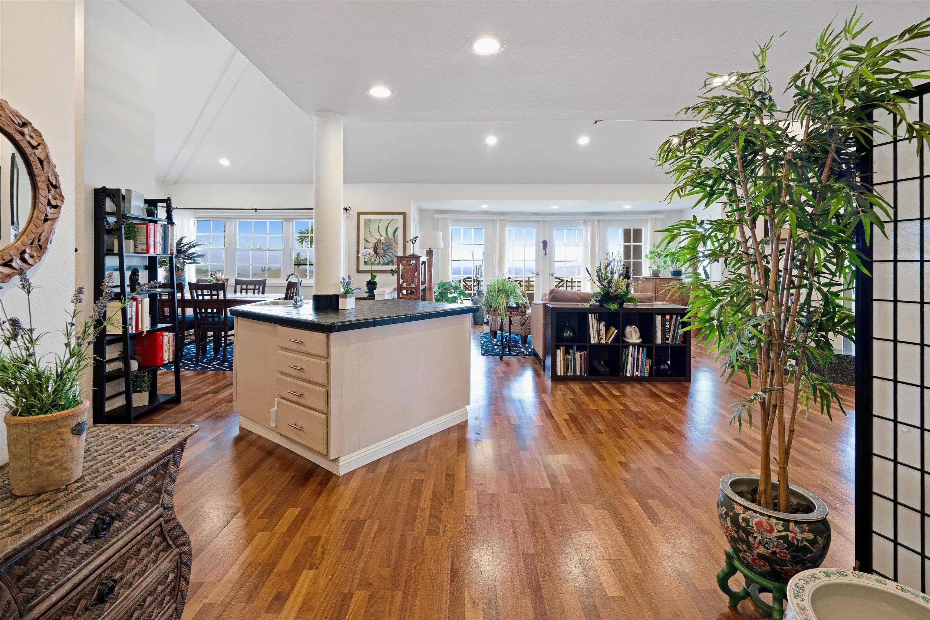 571 South Alu Road Wailuku, HI 96793 - Photo 15 of 49 a kitchen with stainless steel appliances kitchen island granite countertop a stove and a wooden floors