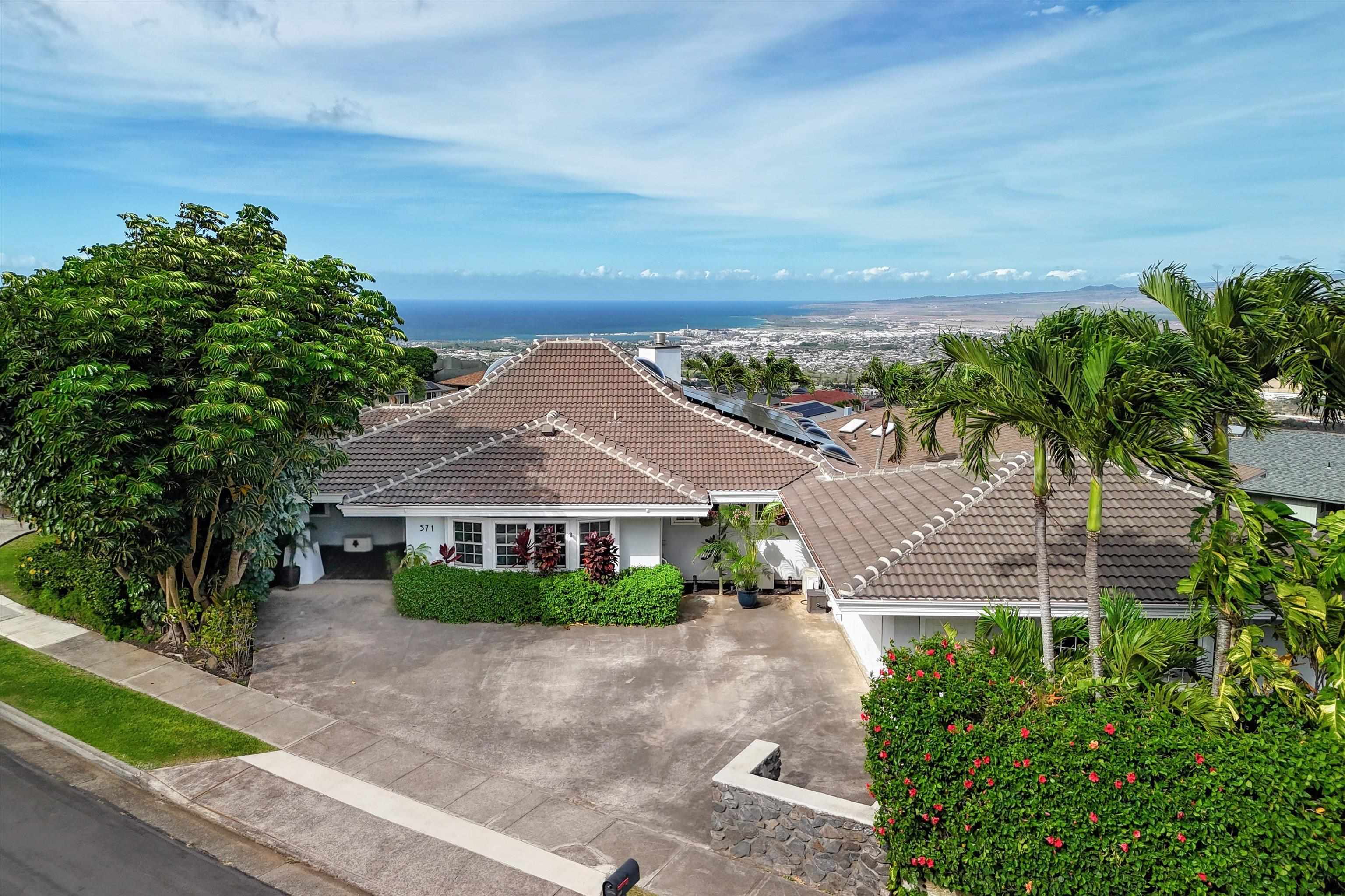 571 South Alu Road Wailuku, HI 96793 - Photo 2 of 49 a front view of a house with a yard