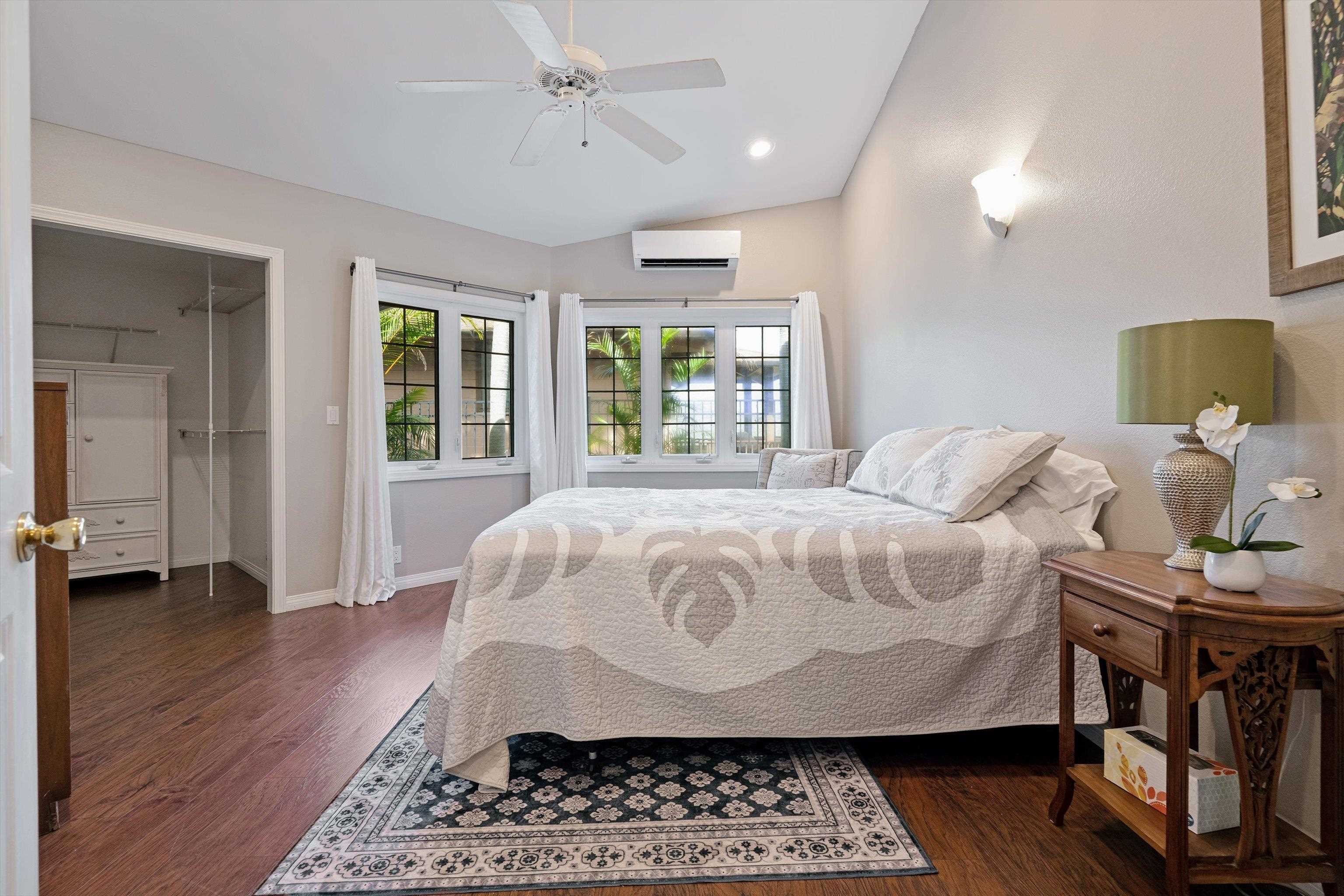 571 South Alu Road Wailuku, HI 96793 - Photo 25 of 49 a bedroom with a bed and wooden floor