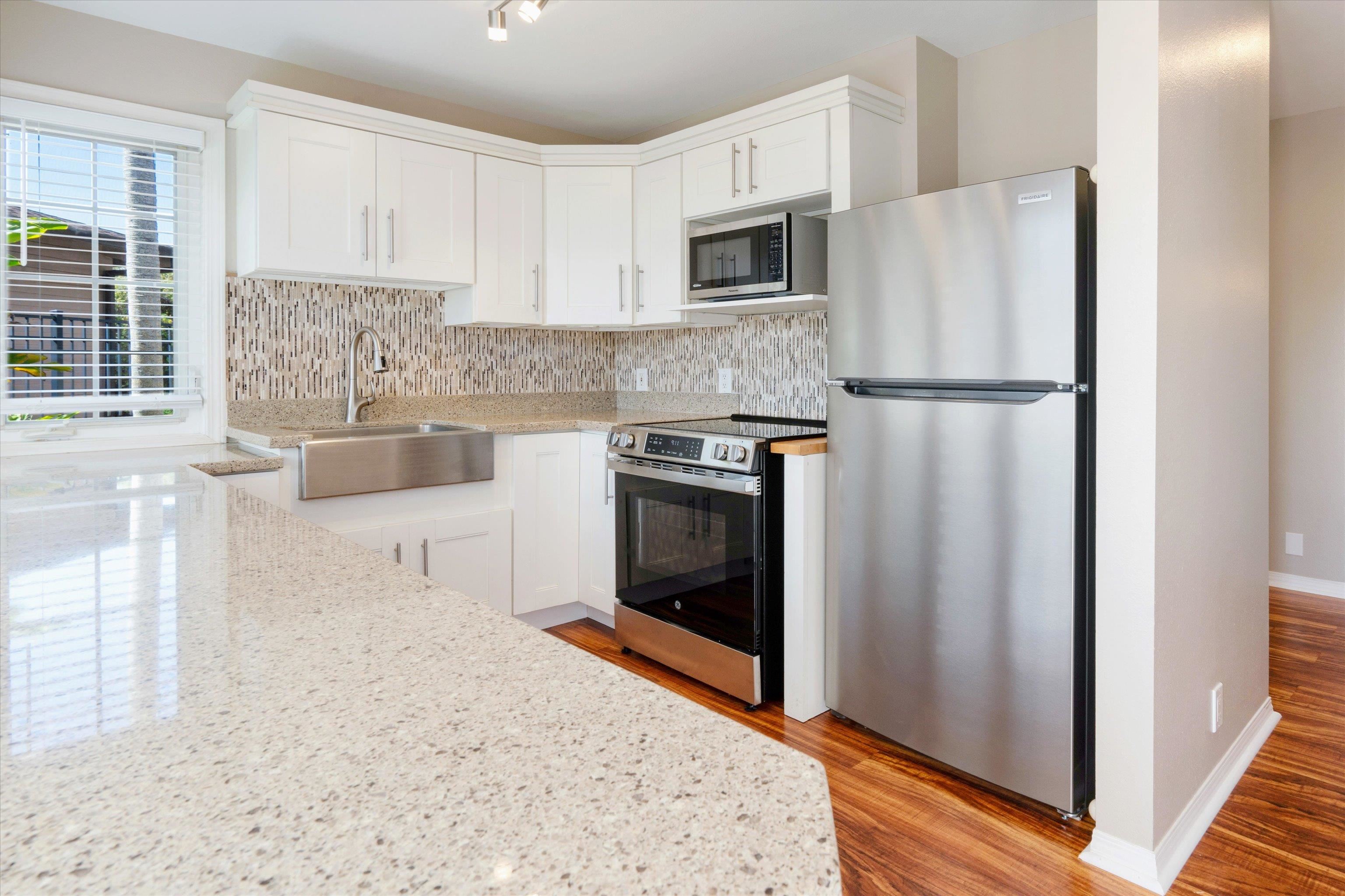 571 South Alu Road Wailuku, HI 96793 - Photo 37 of 49 a kitchen with stainless steel appliances a refrigerator sink and microwave