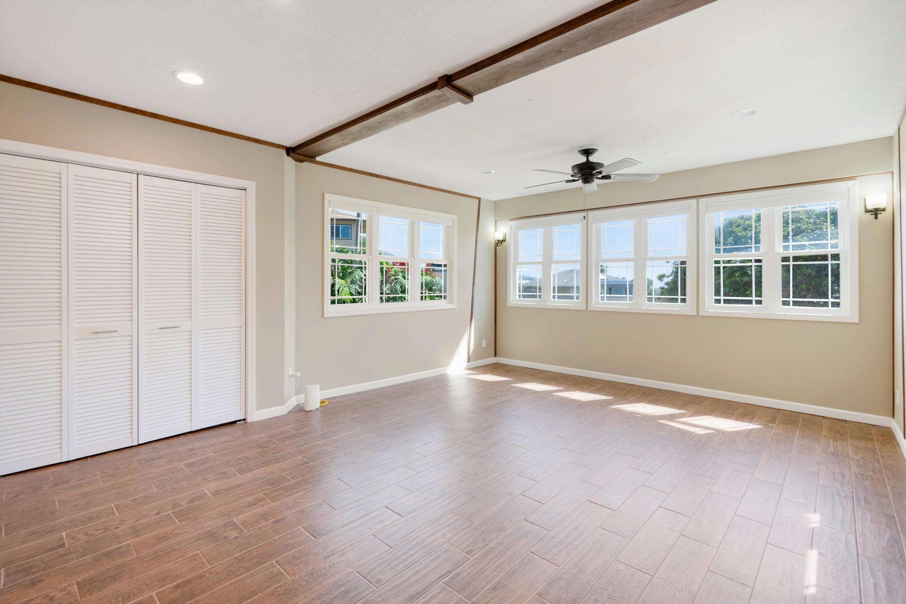 571 South Alu Road Wailuku, HI 96793 - Photo 39 of 49 an empty room with wooden floor and windows