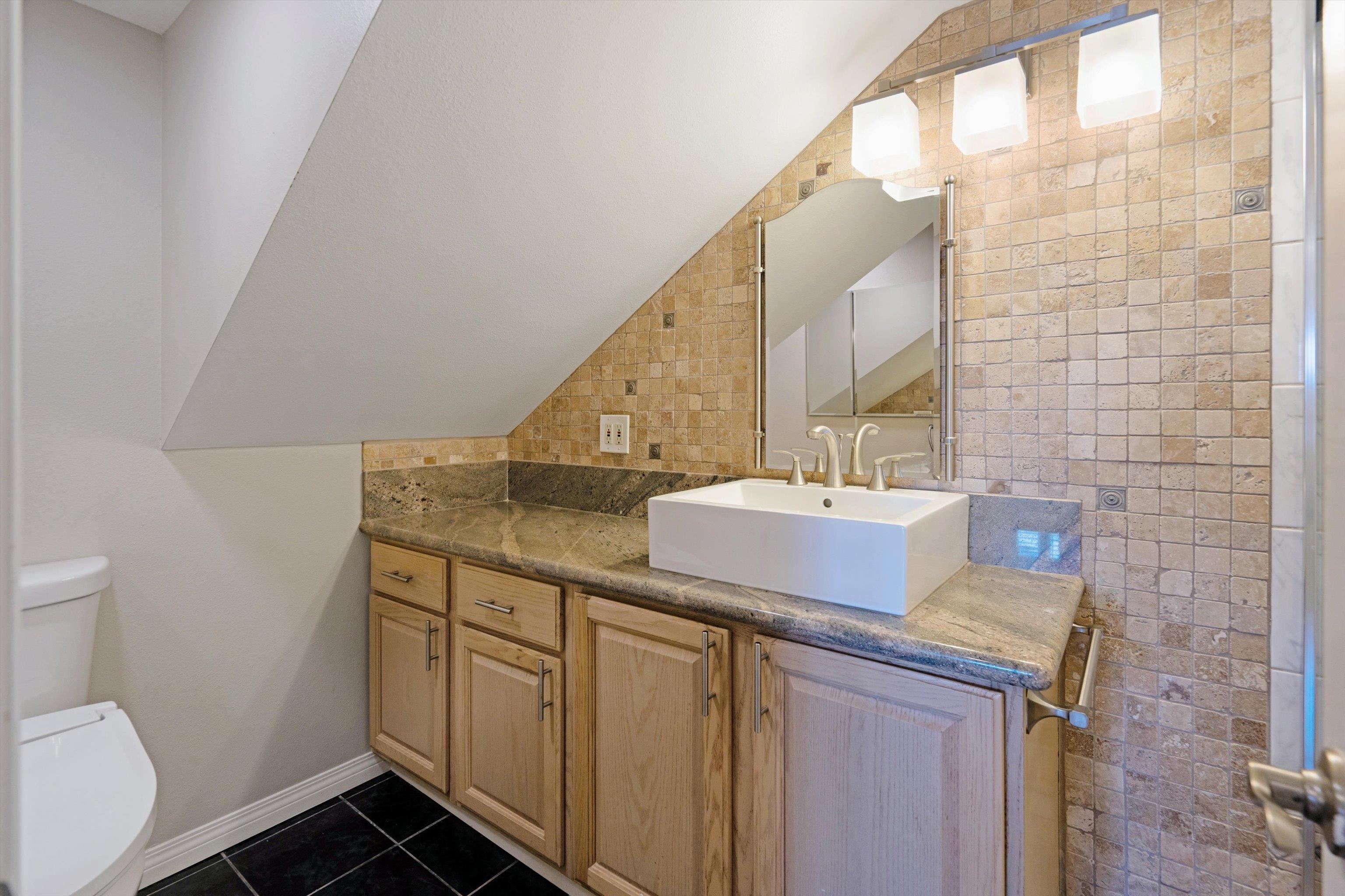 571 South Alu Road Wailuku, HI 96793 - Photo 44 of 49 a bathroom with a sink and a toilet