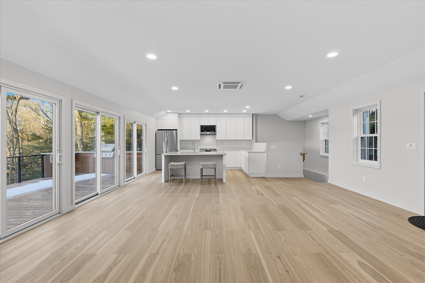 162 Main Street Osterville, MA 02655 - Photo 15 of 47 a view of an empty room with wooden floor and a window