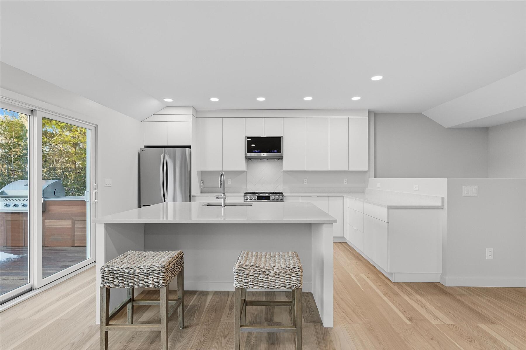 162 Main Street Osterville, MA 02655 - Photo 16 of 47 a kitchen with counter and chairs