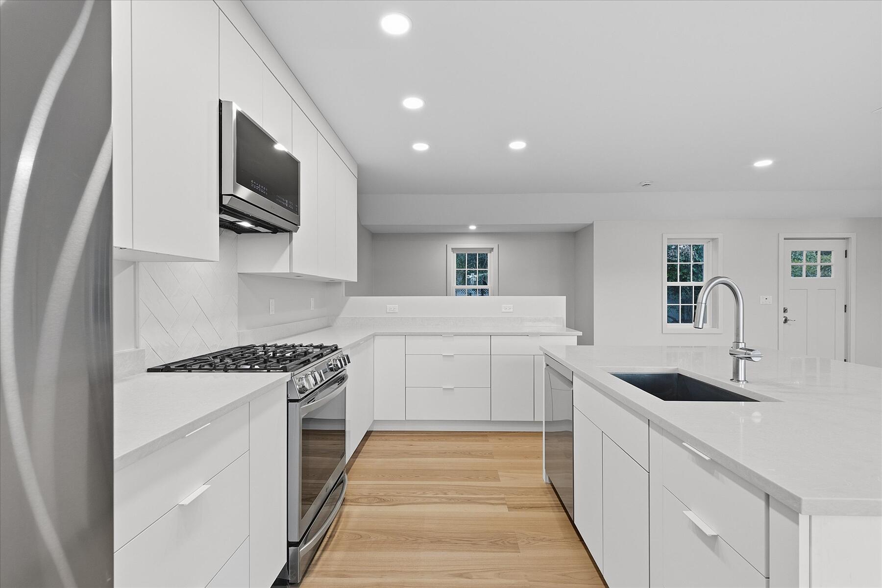 162 Main Street Osterville, MA 02655 - Photo 17 of 47 a kitchen with a sink stove and microwave
