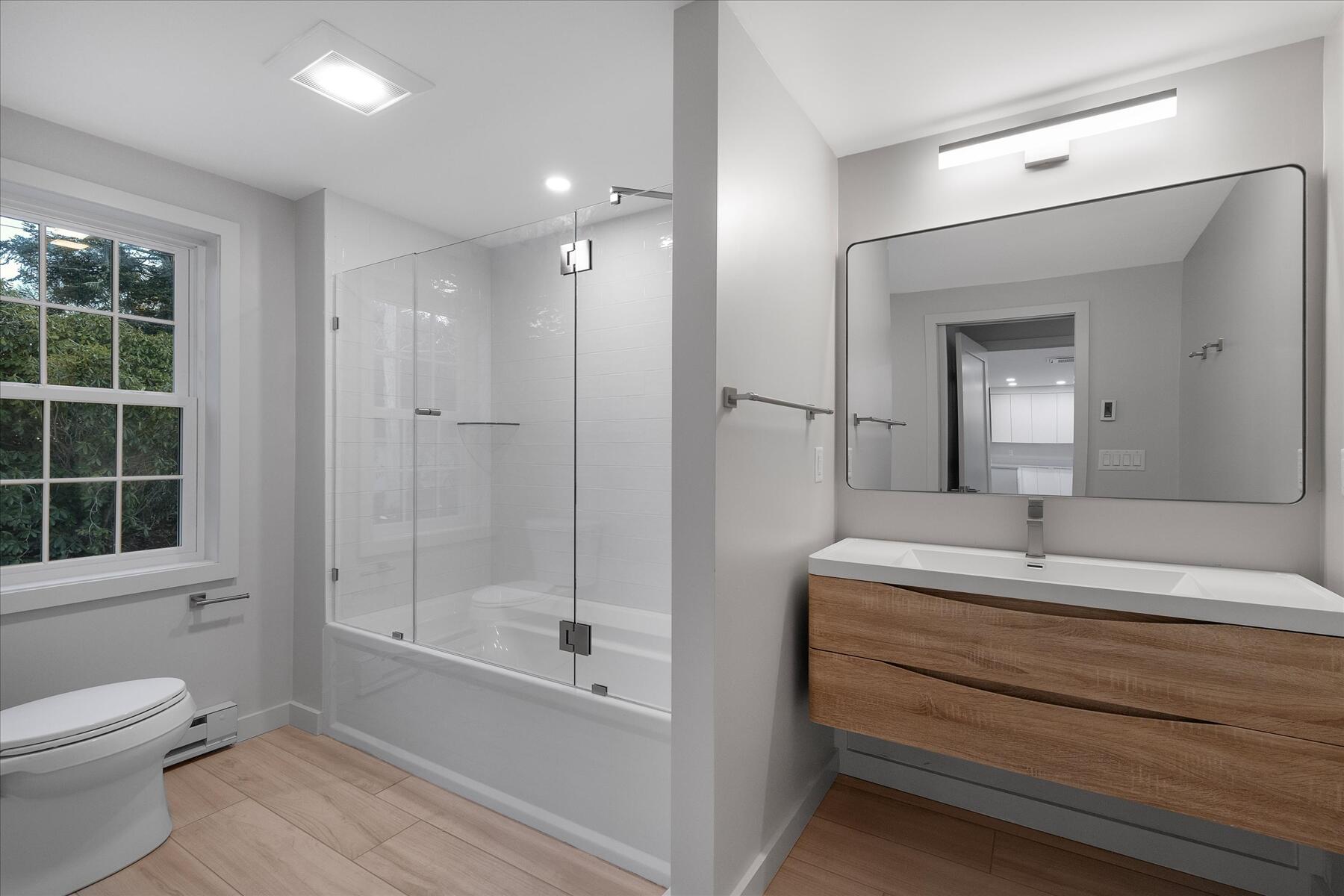 162 Main Street Osterville, MA 02655 - Photo 20 of 47 a bathroom with a sink a toilet and shower