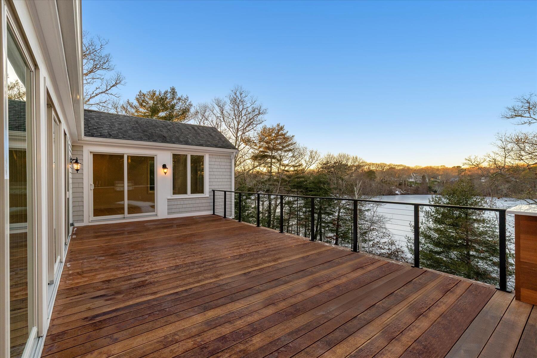 162 Main Street Osterville, MA 02655 - Photo 2 of 47 a view of a house with a wooden deck