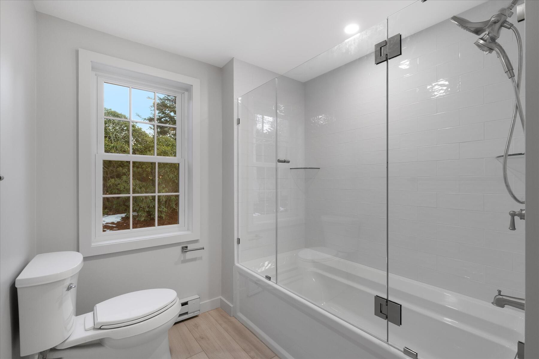 162 Main Street Osterville, MA 02655 - Photo 21 of 47 a bathroom with a granite countertop toilet a sink and shower