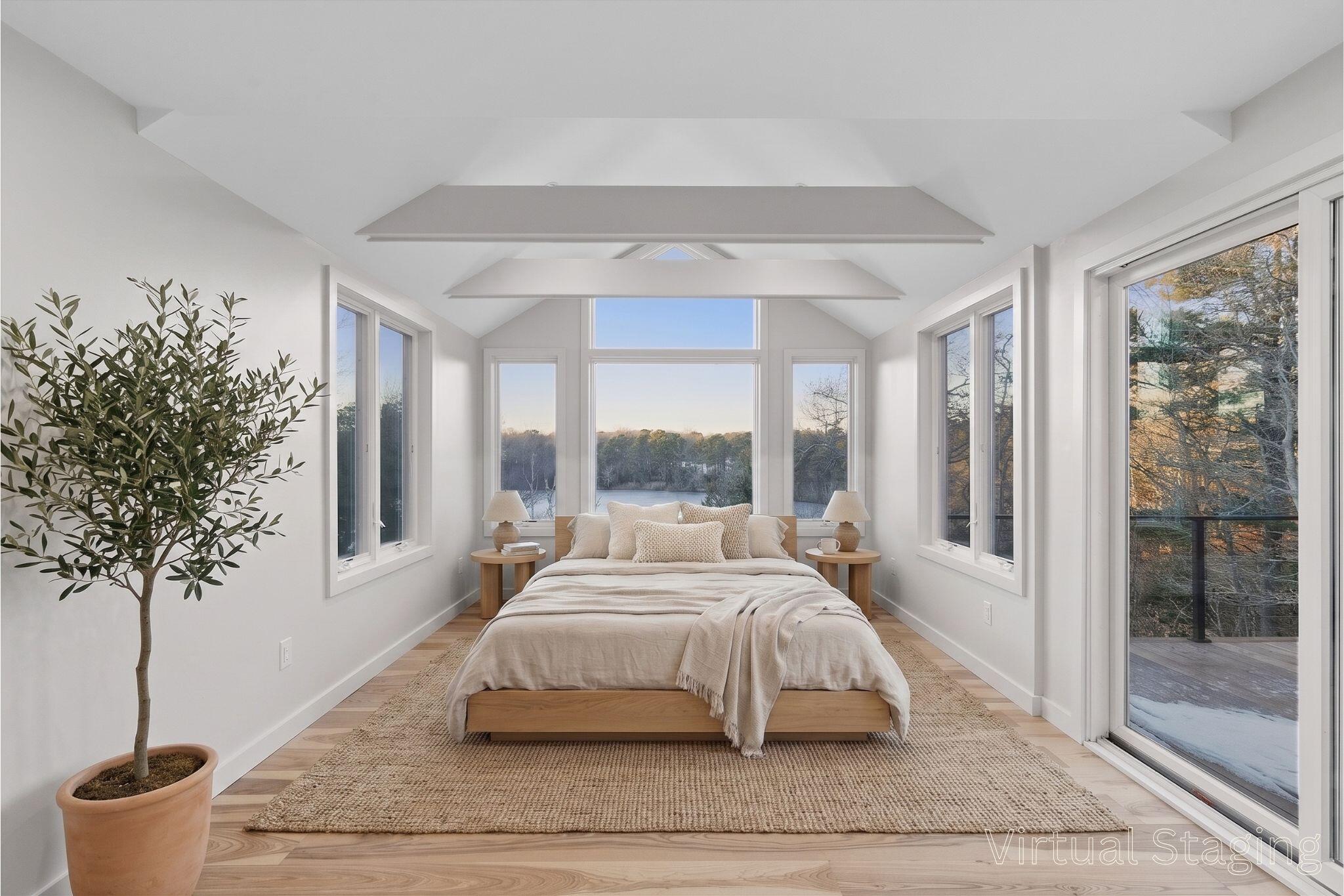 162 Main Street Osterville, MA 02655 - Photo 24 of 47 a bedroom with a large bed and a potted plant