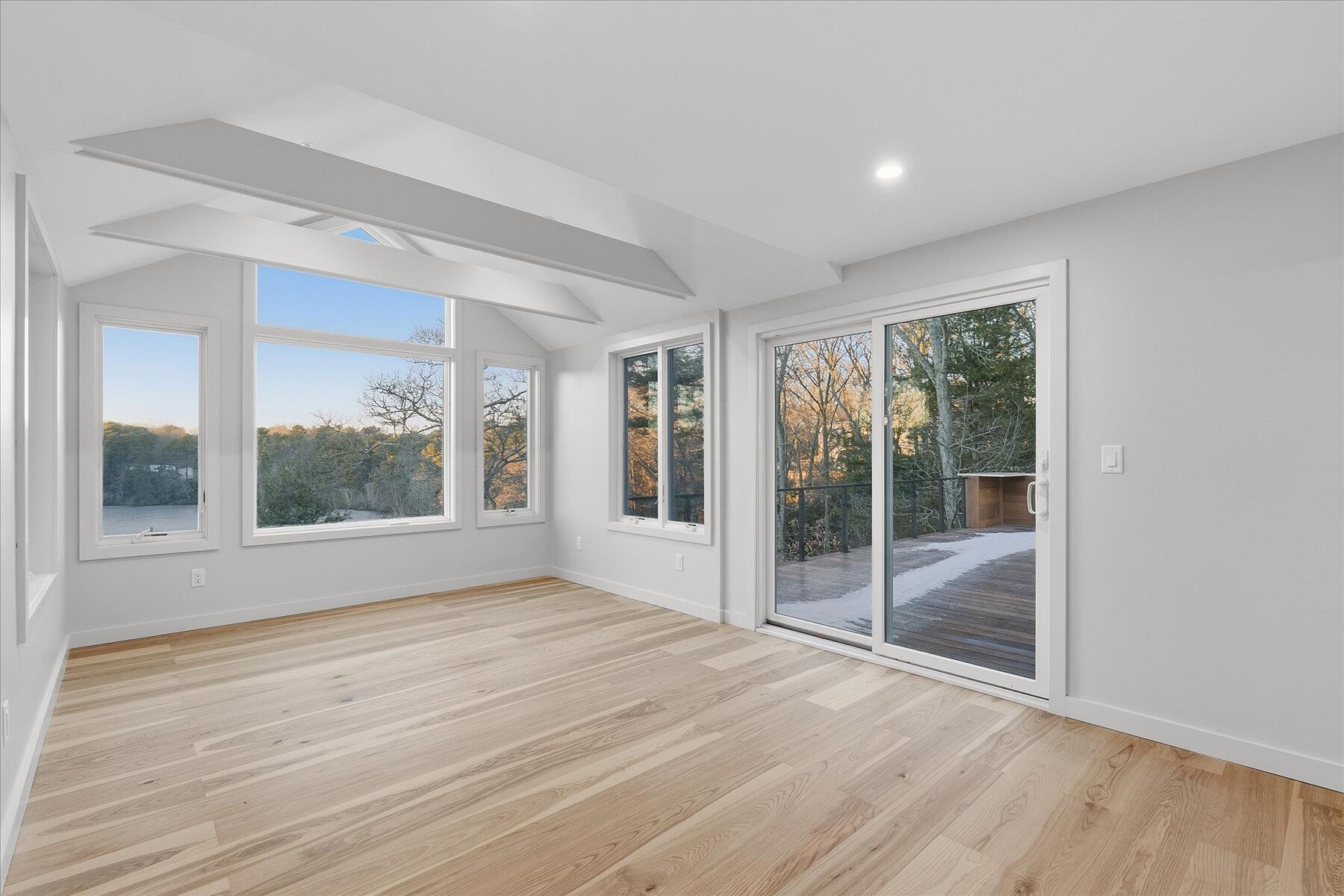 162 Main Street Osterville, MA 02655 - Photo 25 of 47 a view of an empty room with wooden floor and a window