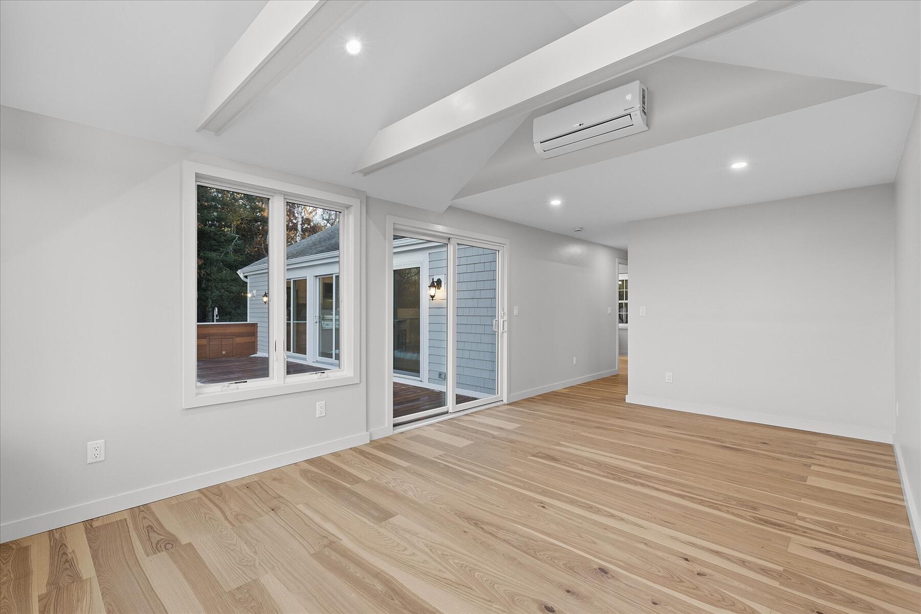 162 Main Street Osterville, MA 02655 - Photo 26 of 47 a view of an empty room with wooden floor and a window