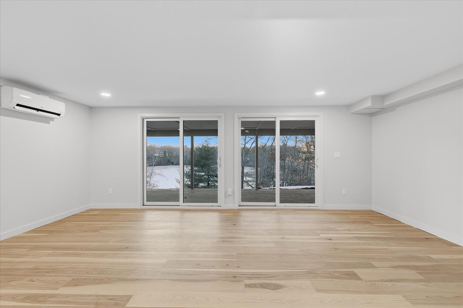 162 Main Street Osterville, MA 02655 - Photo 27 of 47 a view of an empty room with wooden floor and fan