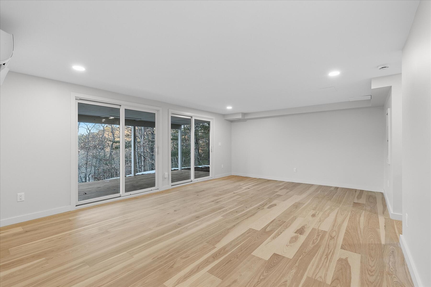 162 Main Street Osterville, MA 02655 - Photo 28 of 47 a view of an empty room with wooden floor and a window
