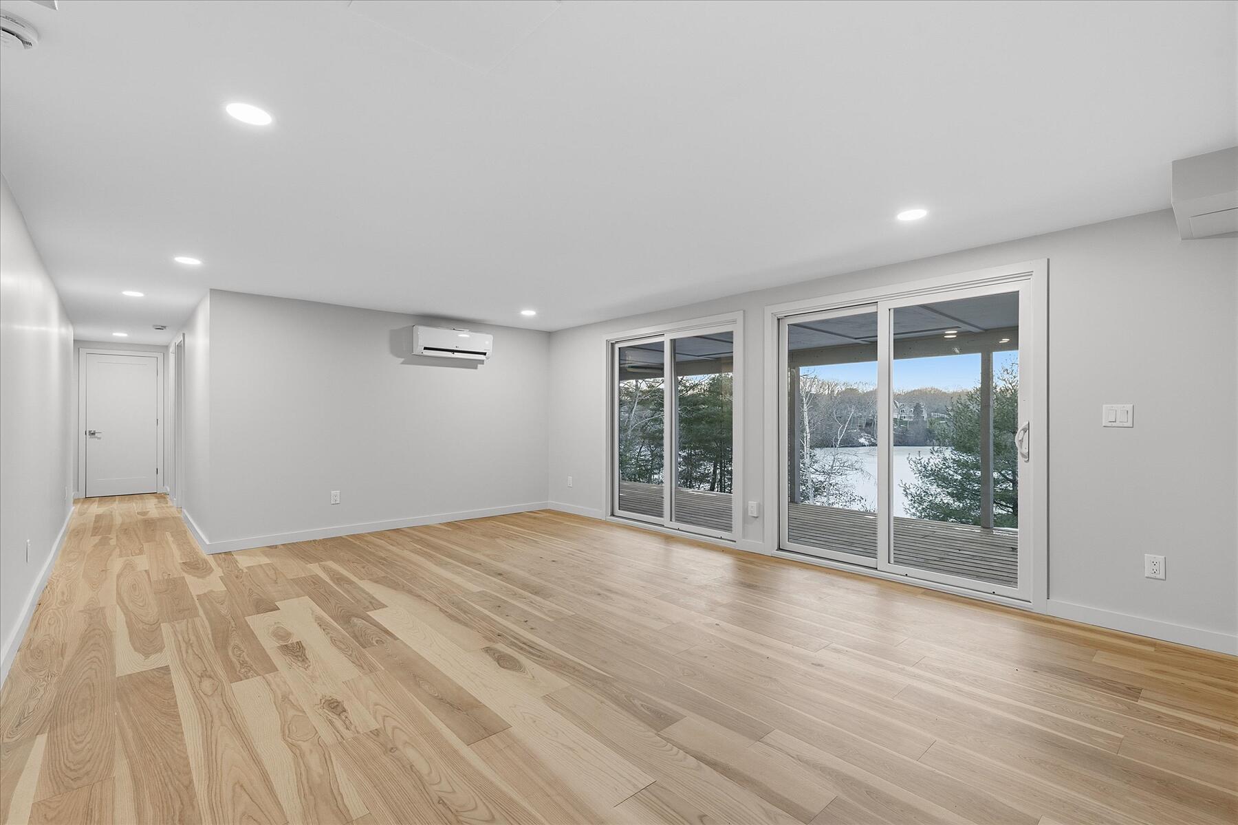 162 Main Street Osterville, MA 02655 - Photo 30 of 47 a view of an empty room with wooden floor and a window