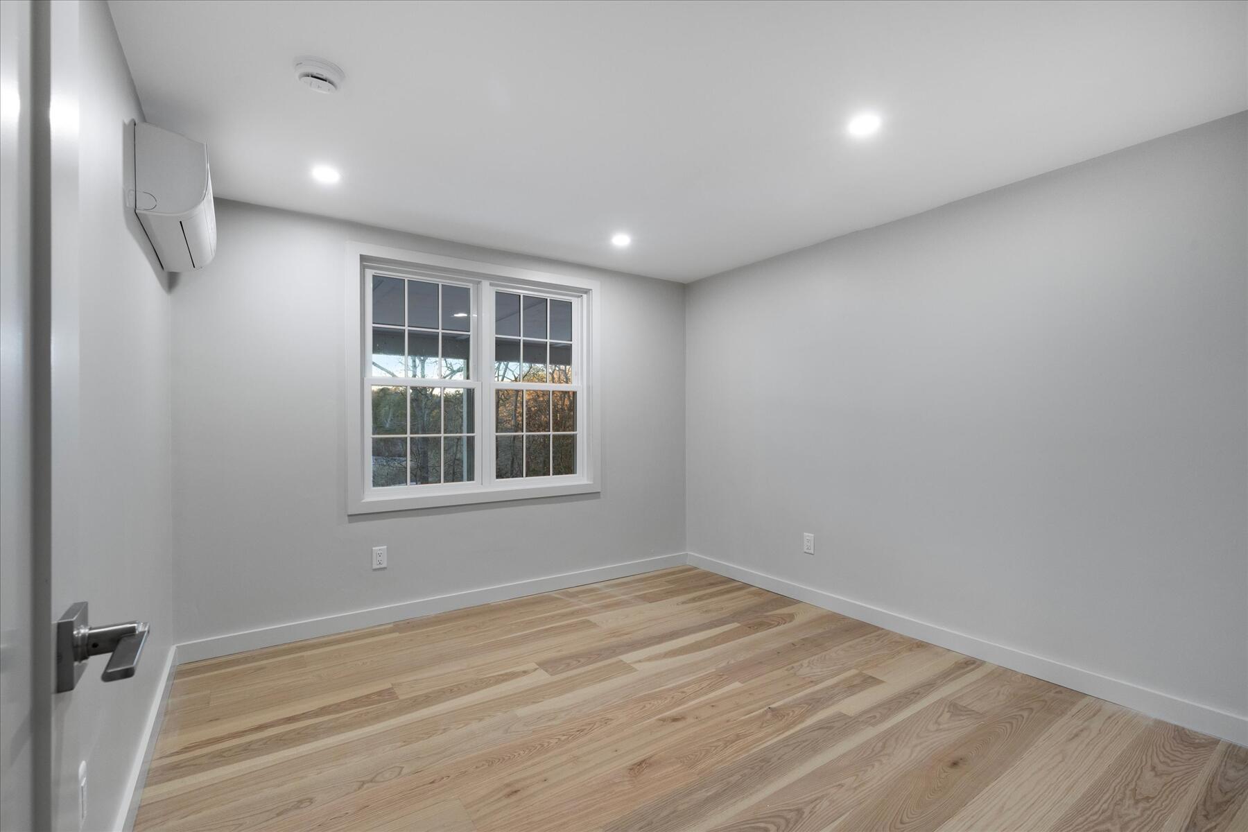 162 Main Street Osterville, MA 02655 - Photo 31 of 47 a view of empty room with wooden floor and fan