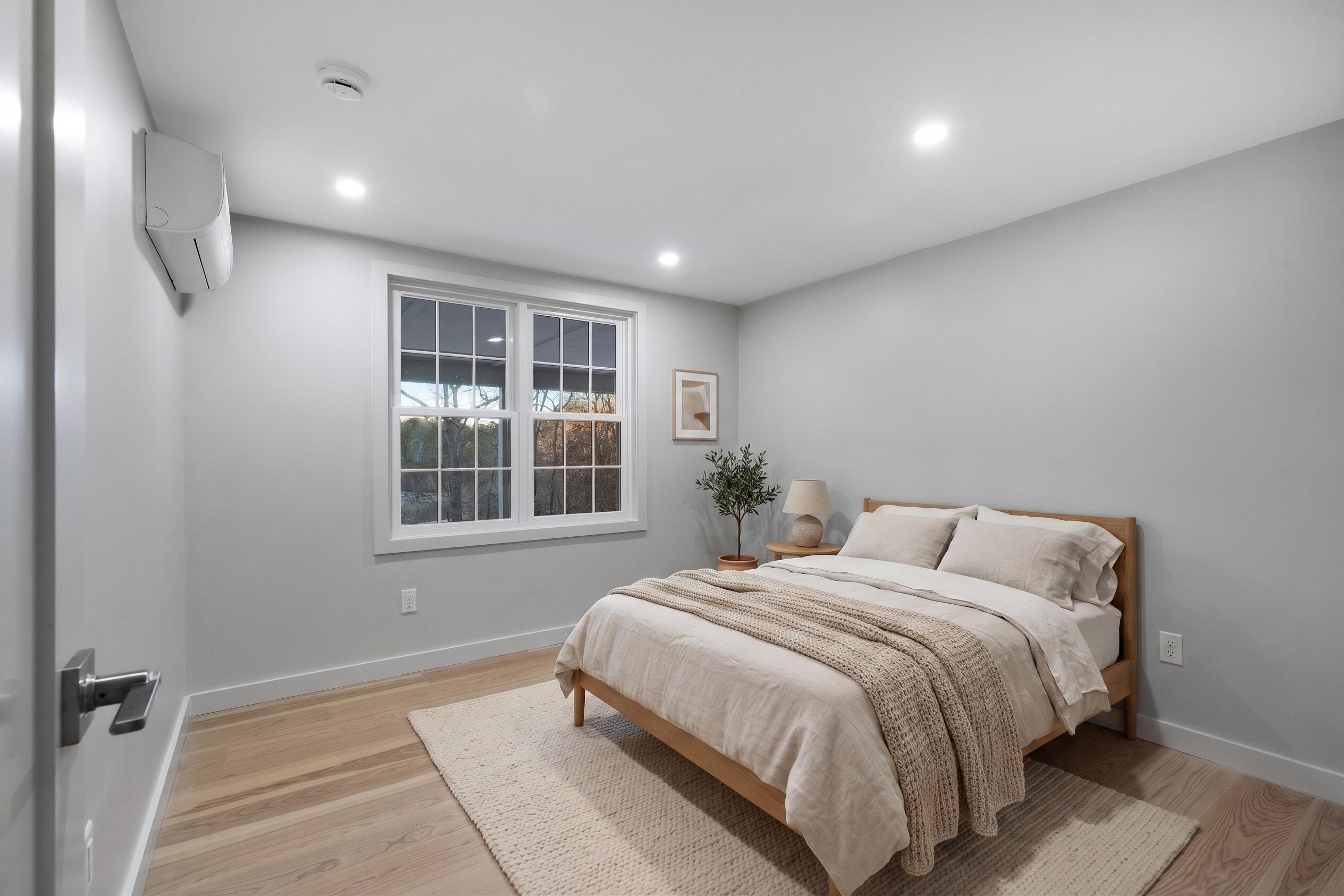 162 Main Street Osterville, MA 02655 - Photo 32 of 47 a bedroom with a large bed and a window