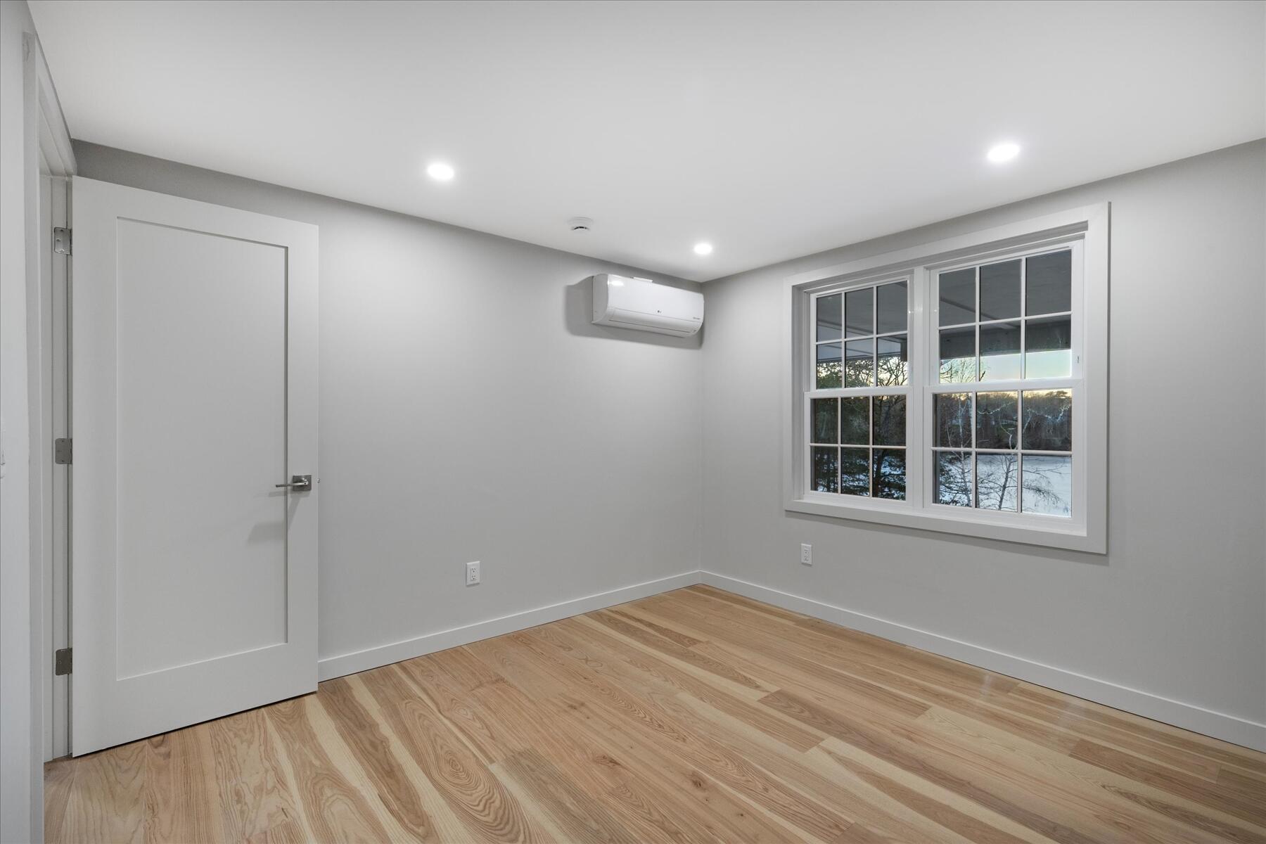 162 Main Street Osterville, MA 02655 - Photo 33 of 47 a view of empty room with wooden floor and fan