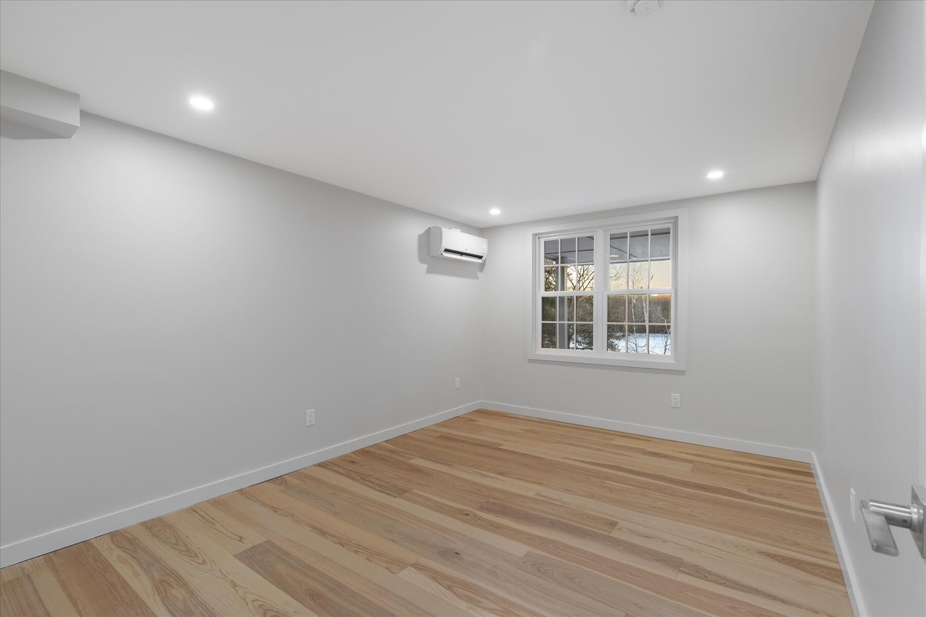 162 Main Street Osterville, MA 02655 - Photo 34 of 47 a view of an empty room with wooden floor and a window