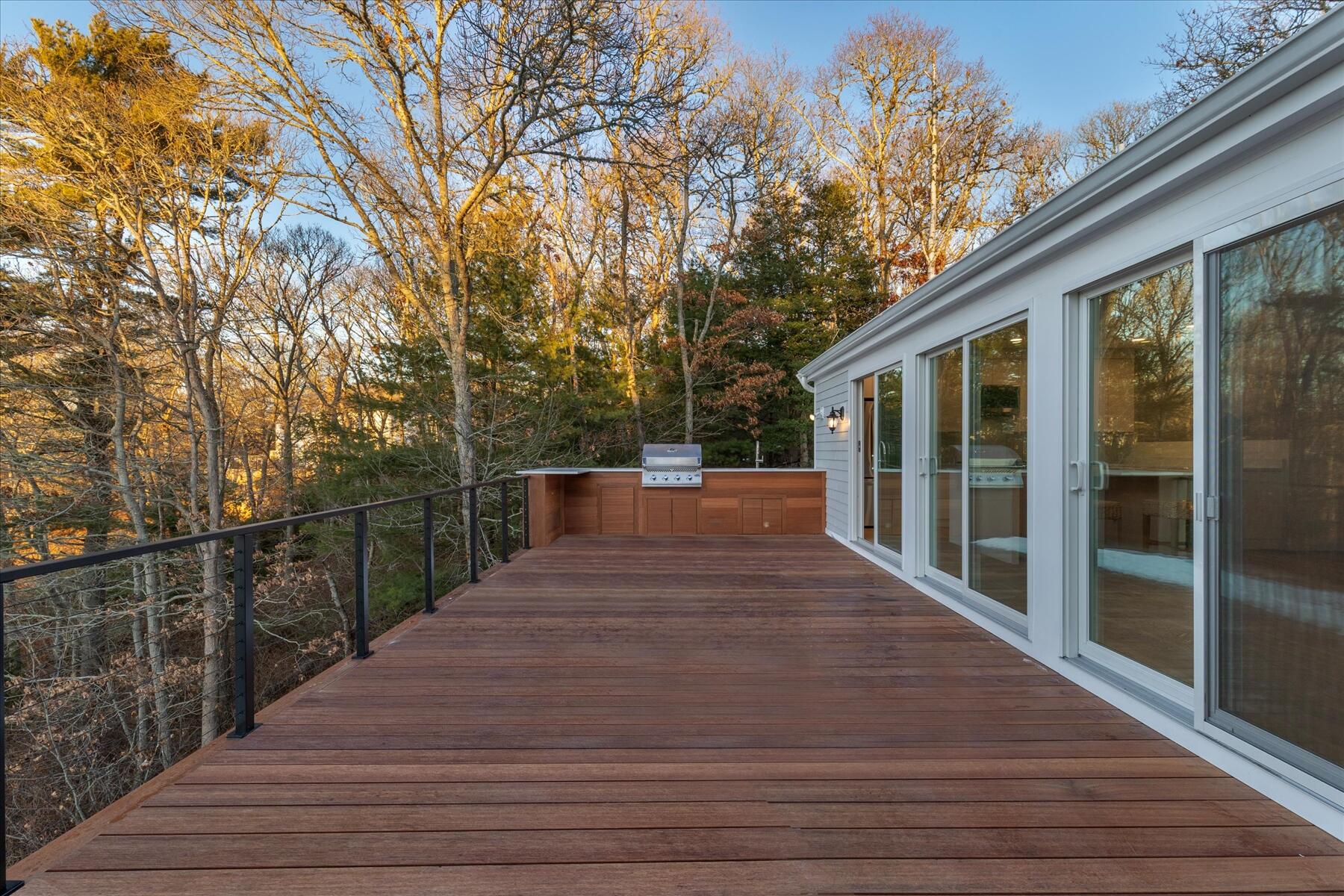 162 Main Street Osterville, MA 02655 - Photo 4 of 47 a view of balcony with wooden floor and fence