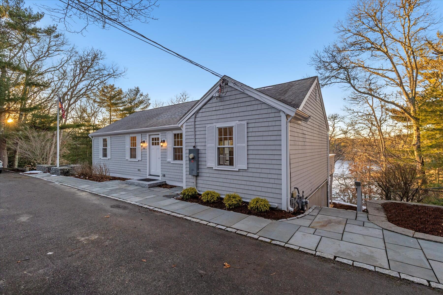 162 Main Street Osterville, MA 02655 - Photo 42 of 47 a front view of a house with a garden