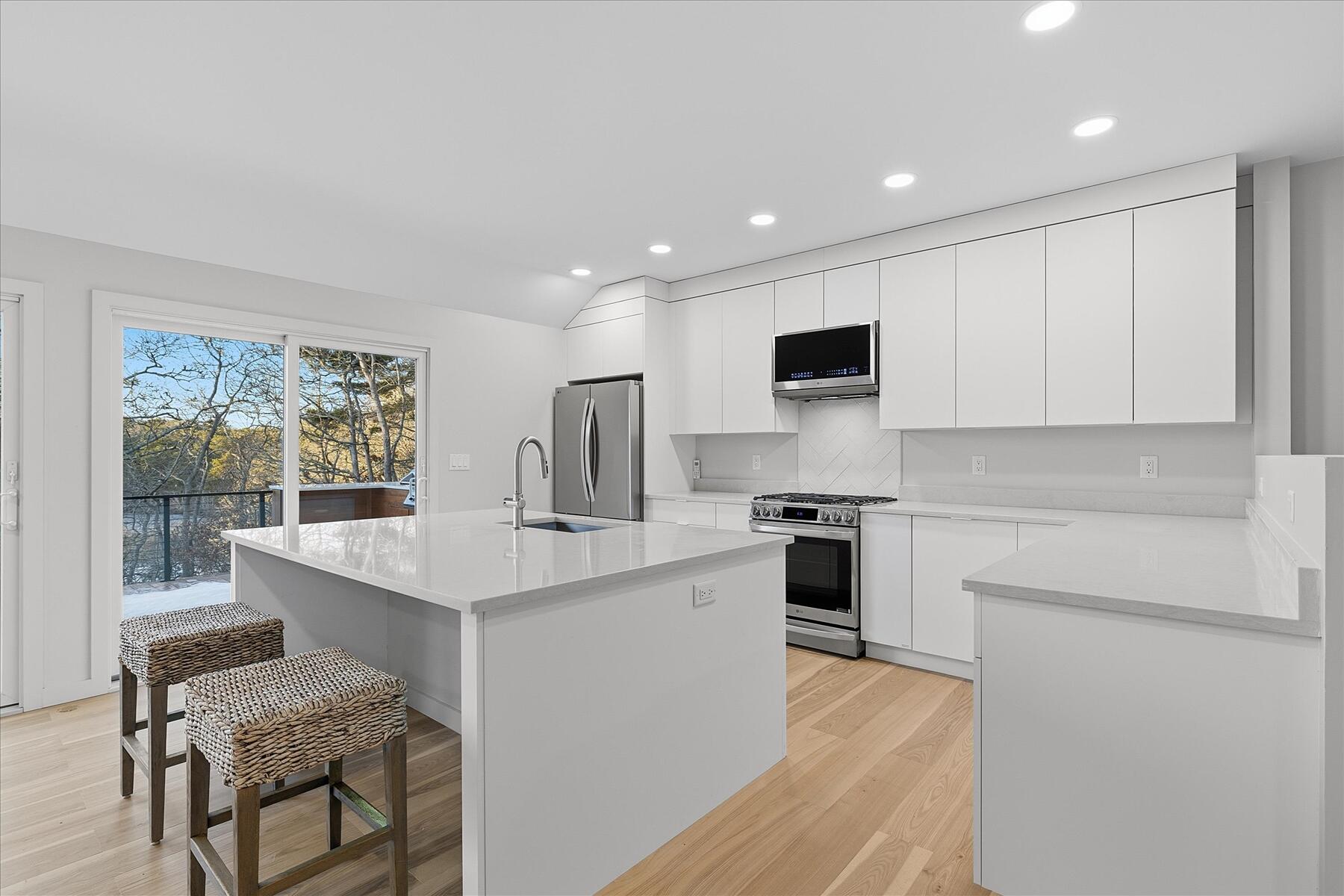 162 Main Street Osterville, MA 02655 - Photo 7 of 47 a kitchen with a sink cabinets and wooden floor