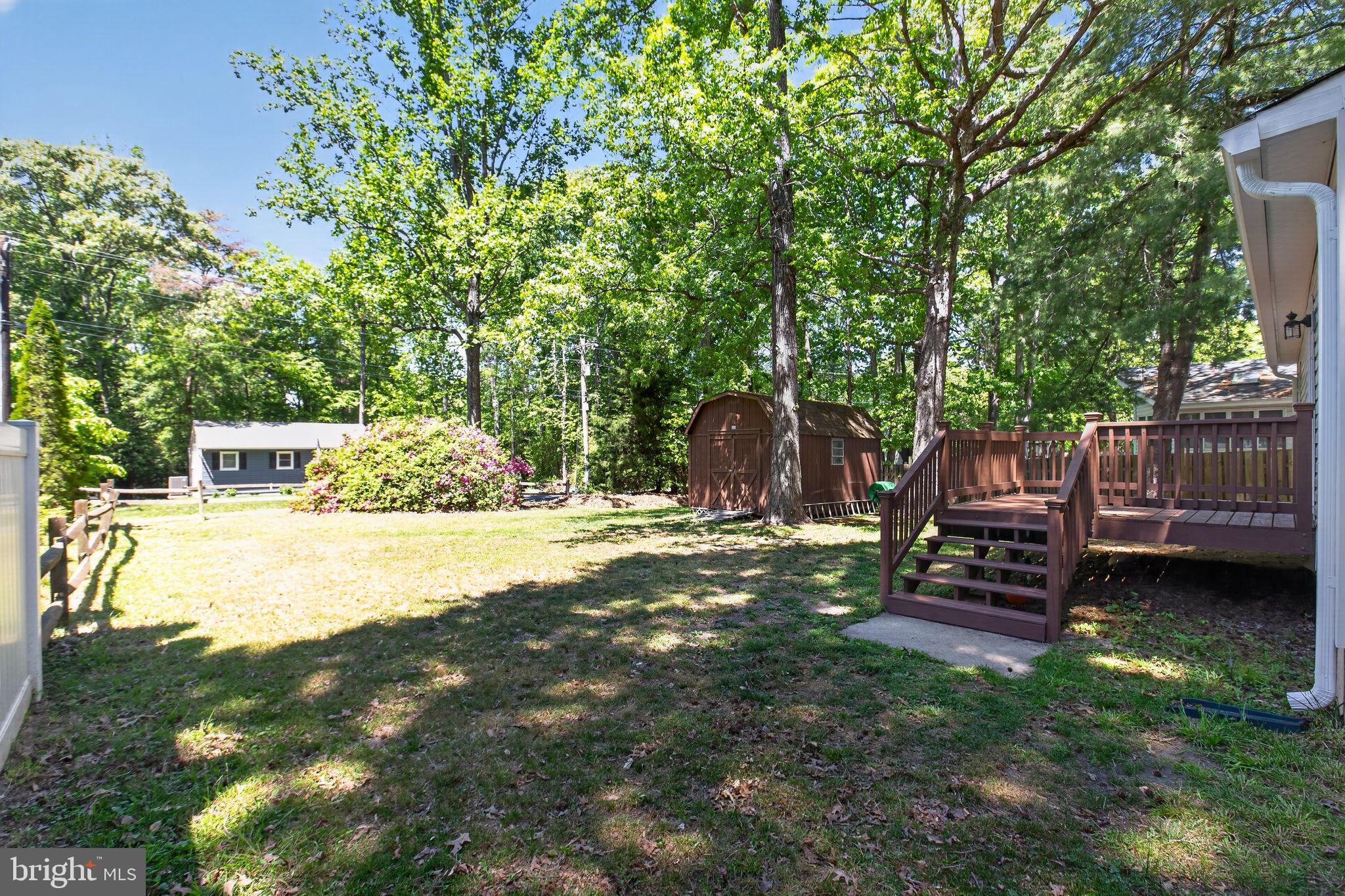 11789 Little Cove Point Road Lusby, MD 20657 - Photo 7 of 16 a view of a backyard with sitting area