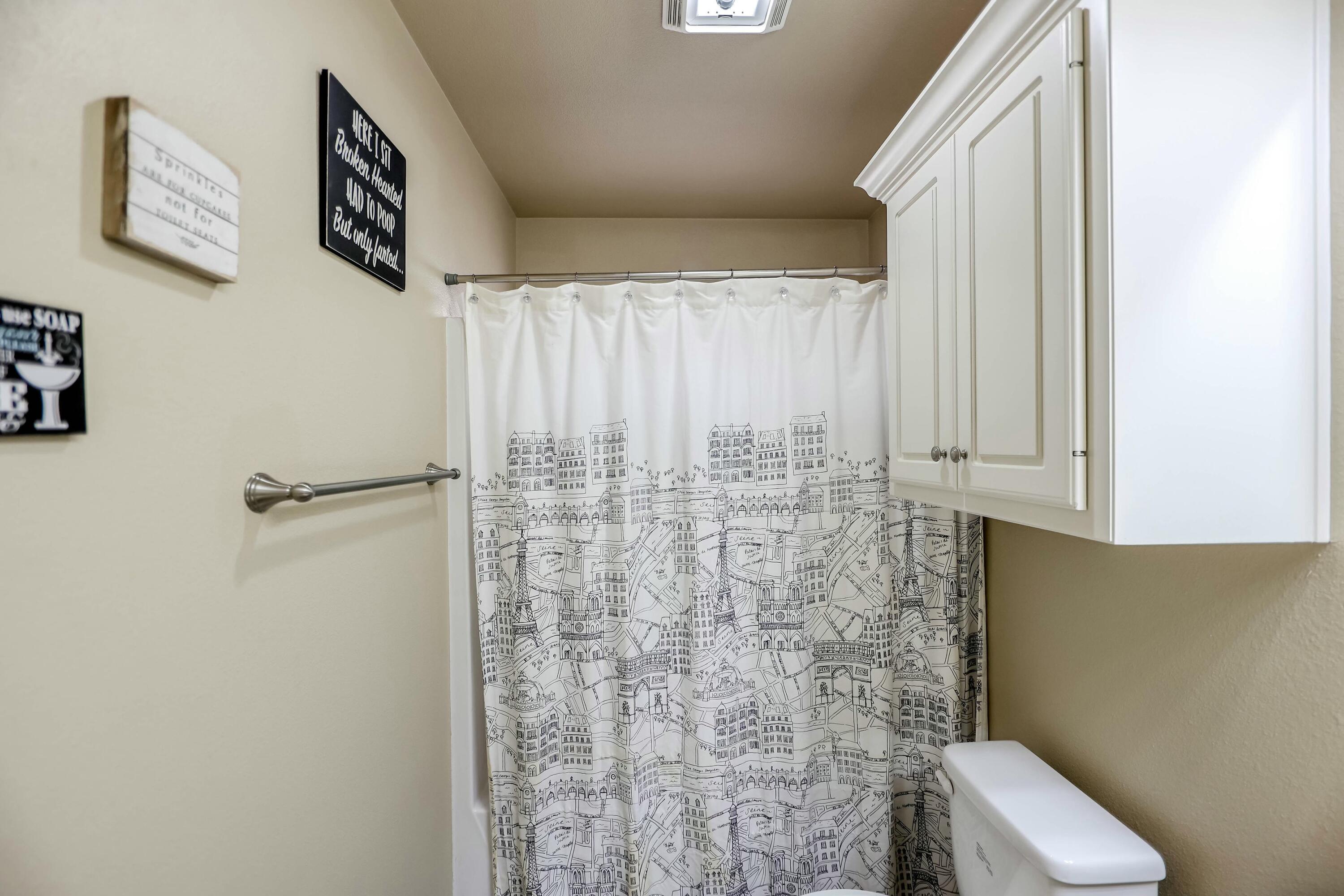 5920 104th Street Lubbock, TX 79424 - Photo 14 of 26 a bathroom with a toilet and shower