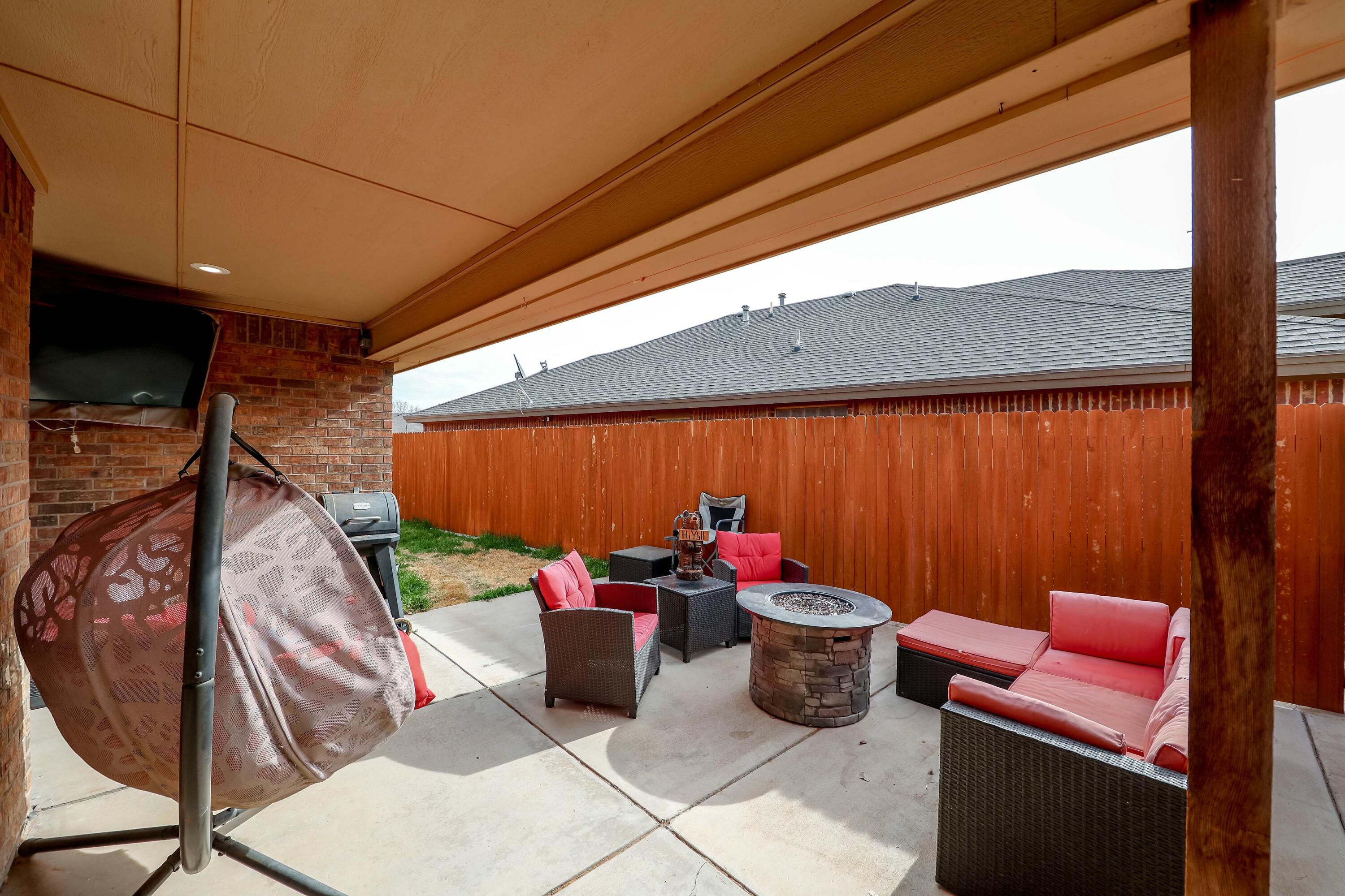 5920 104th Street Lubbock, TX 79424 - Photo 20 of 26 a table and chairs in the patio