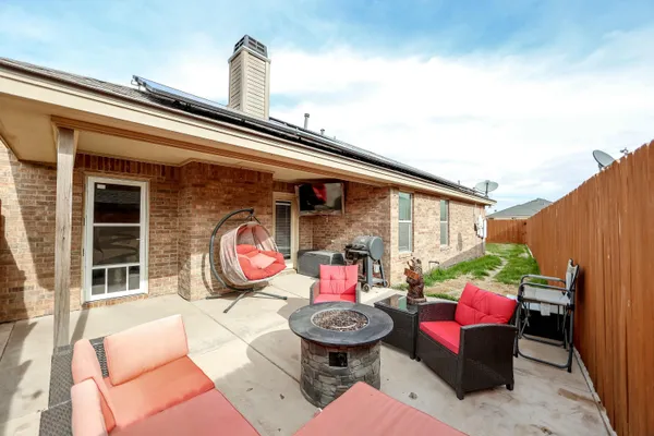 a view of a two chairs in the balcony