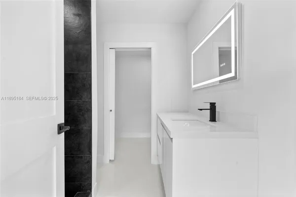 a utility room with a sink dryer and washer