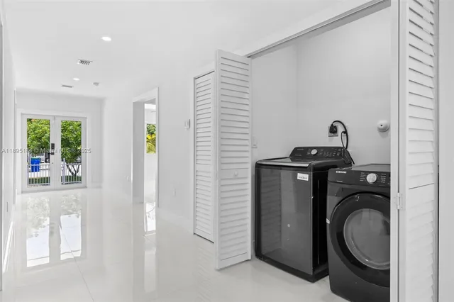 a kitchen with granite countertop a sink and cabinets