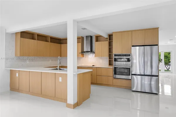 a large kitchen with cabinets