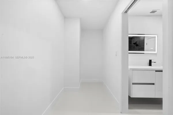 a view of a room with a bathroom