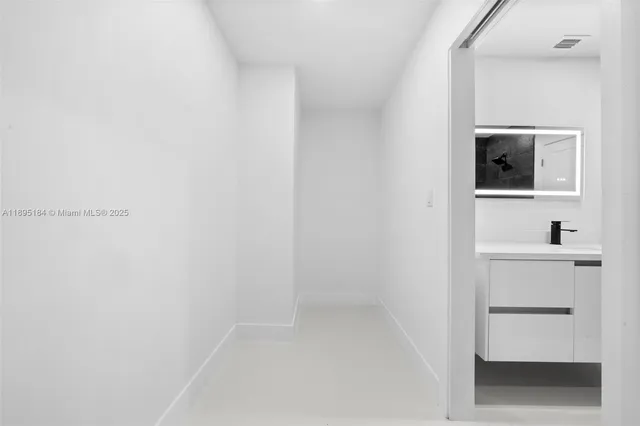 a view of a room with a bathroom