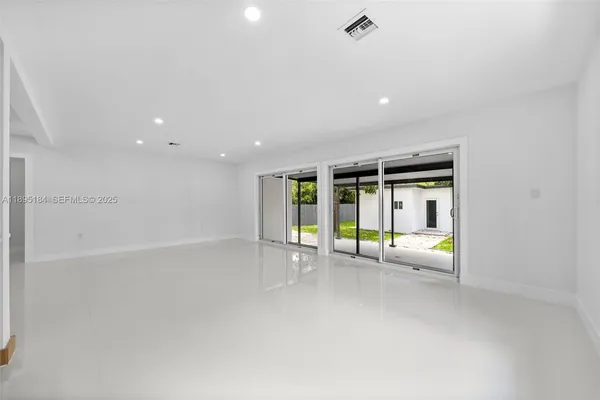 a view of an entrance with wooden fence