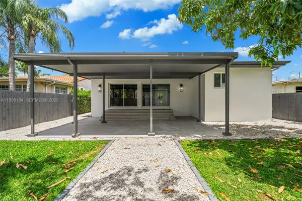 a house with trees in the background