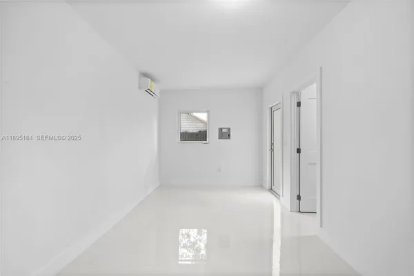 an empty room with a bathroom