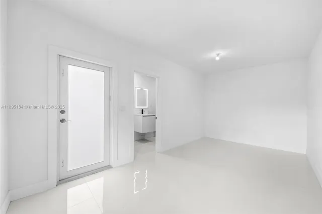 a bathroom with a shower and a sink