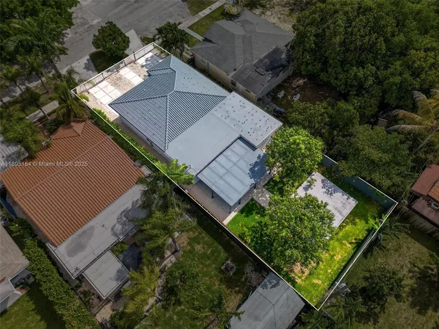 an aerial view of house with yard