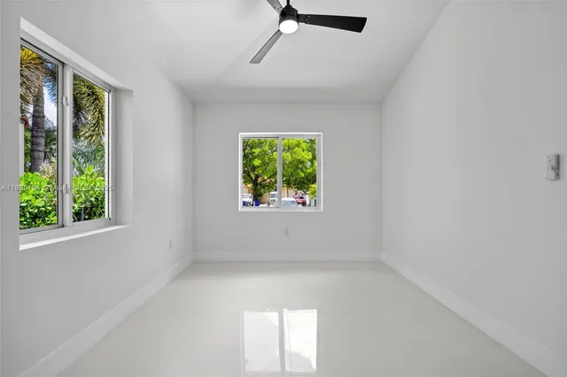 an empty room with windows