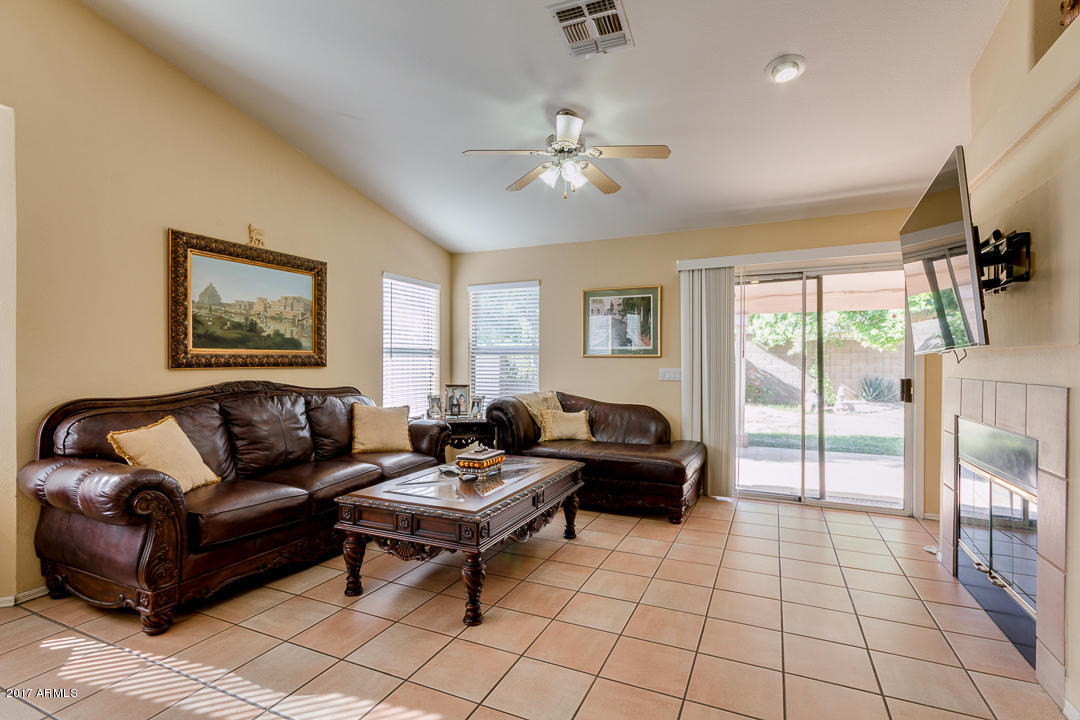 4030 West Cactus Road Phoenix, AZ 85029 - Photo 11 of 29 a living room with furniture and a floor to ceiling window